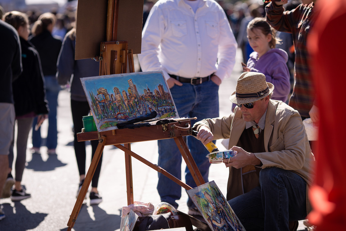 Artist Trahern Cook paints for the crowds at Soda City Market